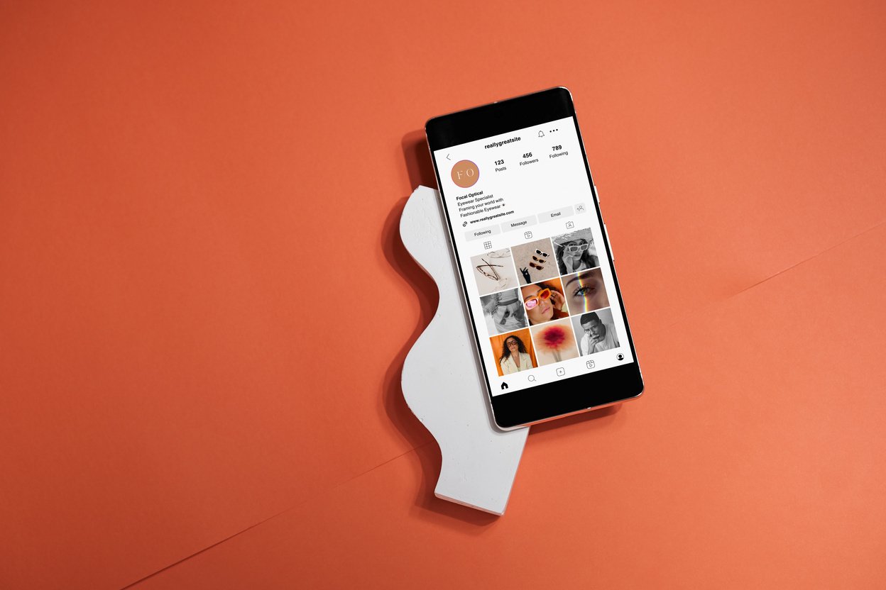 Social Media Mockup on Smartphone on Orange Background